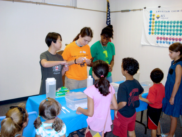 (above) Union High School students from Mrs. Wisniewski's Chemistry Club recently participated in volunteer community outreach by presenting two hands-on science programs for the children at the Union Pubic Library. The children were given the opportunity to perform many fun activities such as creating gel 'worms', making paper disappear, and building molecules. The Club members who participated were Emma Schmalfeld, Erin O'Connor, Crystal Simon, Andrew Wasden, and Friedrich Smith.