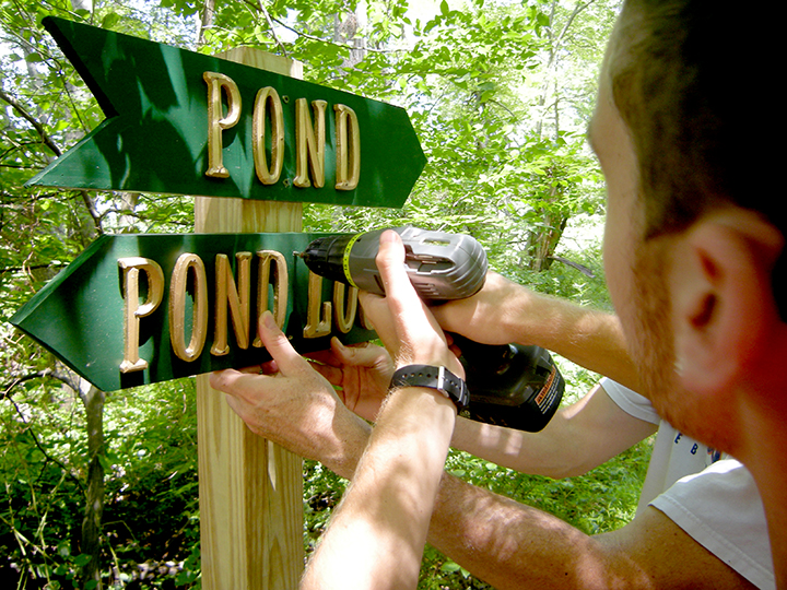 Rob Pilsbury erecting the new signs