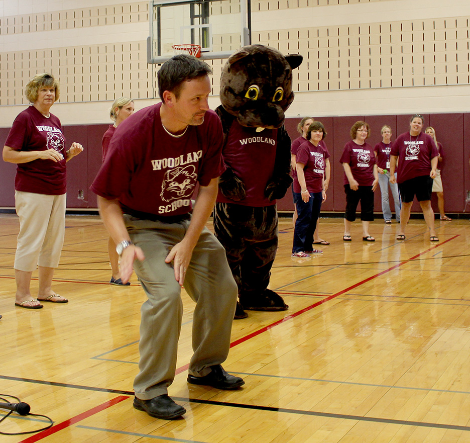 Woodland Principal Jeff Heaney leads the students in calisthenics