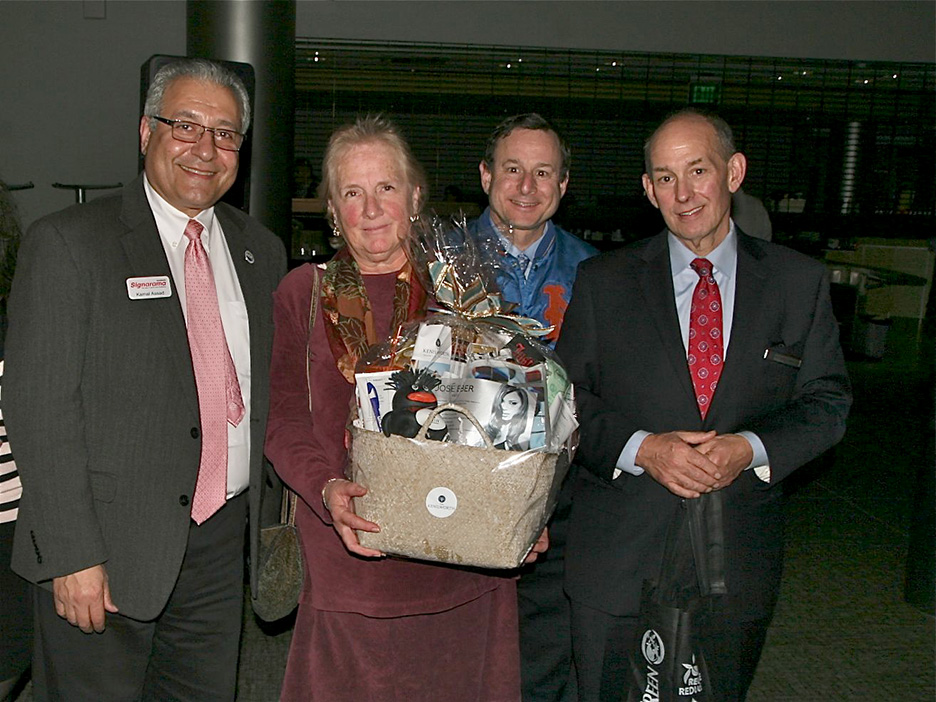 (above) Kenilworth Chamber President Kamal Assad (left) presents the grand prize donated by The Kenilworth.