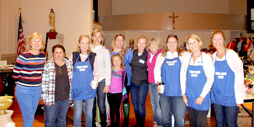 Christ Child Members and Friends Prepare to Open The Doors at 7th Annual Rummage Sale (above l-r) Marilyn Chambeau, Marge Yobbi, Margaret Strong, Kathi Franolich, Paddie Donohue, Paddie's granddaughter Maeve, Lori White, Marjorie Waltinger, Jill Stanley, Lambi Newsham, Kathryn Colao