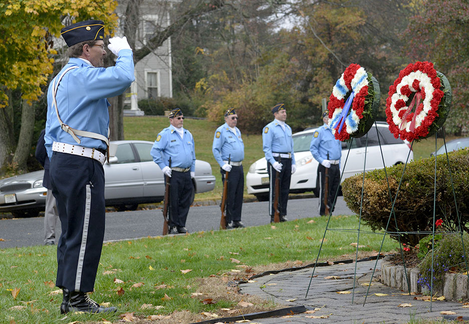 (above) VFW Post 10122 commander Earl Pavlik, an Army veteran of the Vietnam War, delivers a salute after placing a wreath at the memorial in front of the library during Veterans' Day ceremonies in Fanwood, NJ, Wednesday, Nov. 11, 2015. (Photo by Brian Horton)