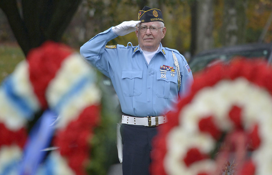 (above) American Legion color guard captain Thomas Keane, a Marine Corps veteran of the Vietnam era, delivers a salute as Taps are played during Veterans' Day ceremonies in Fanwood, NJ, Wednesday, Nov. 11, 2015. (Photo by Brian Horton)