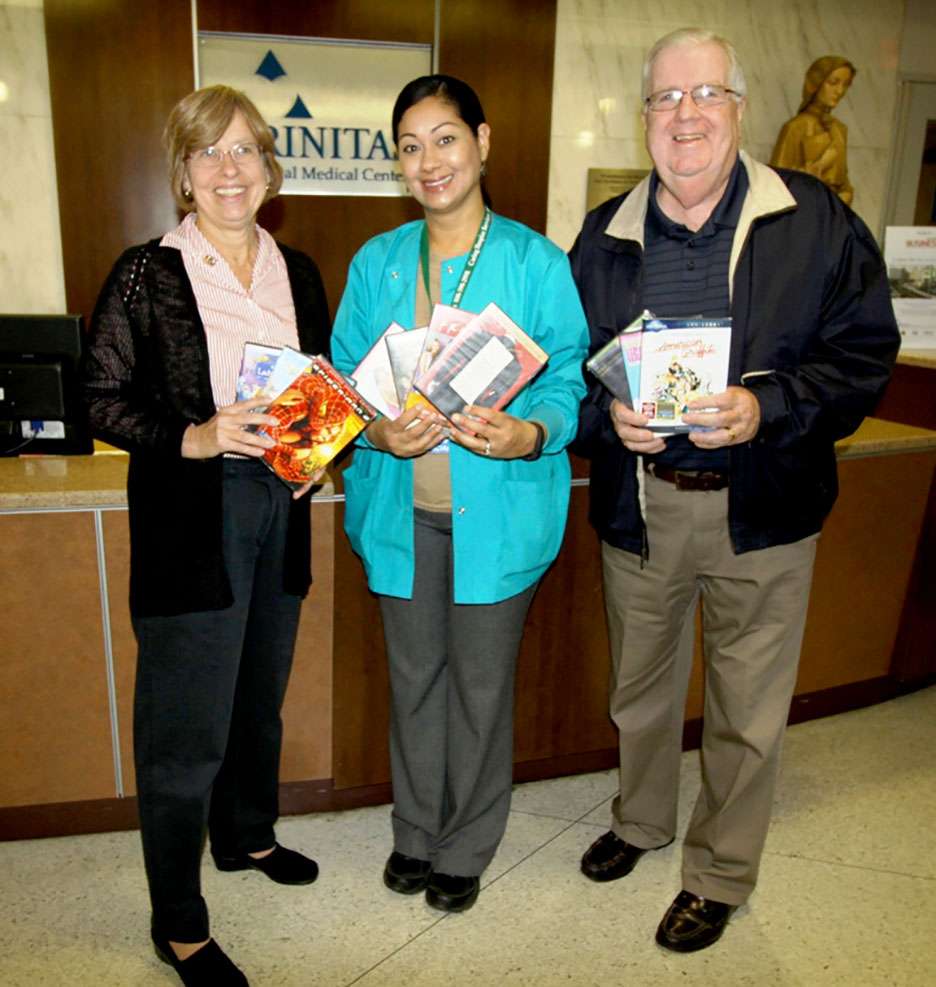 (above) Cranford Rotary President Maureen Strazdon (left) and Service Project Chair Joe Carney present over 100 DVDs to Johanna Thomas, Elder Life Intervention Clinician at Trinitas Regional Medical Center.