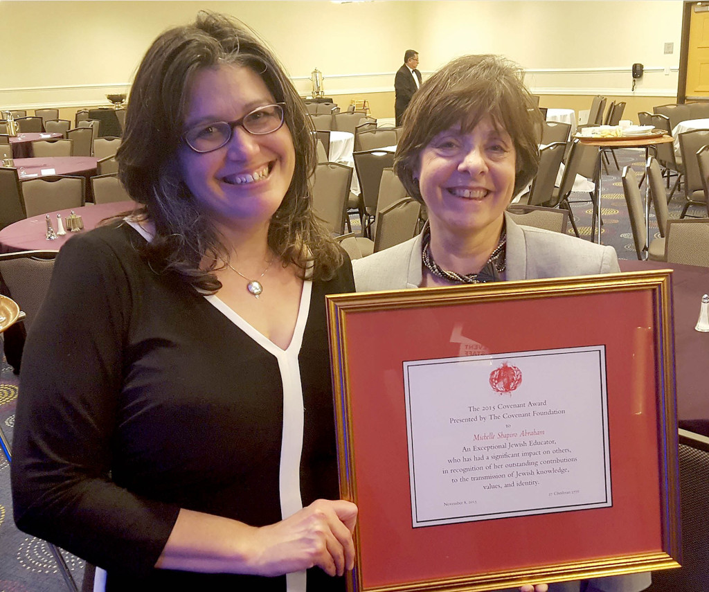 (above, l-r) Temple Sholom member and Fanwood resident Michelle Shapiro-Abraham proudly showcases the Covenant Award for Excellence in Jewish Education she received from the General Assembly of the Jewish Federations of North America. Temple Sholom Past President Sandra Nussenfeld nominated Shapiro-Abraham for the award, which was presented at a dinner in Washington D.C.