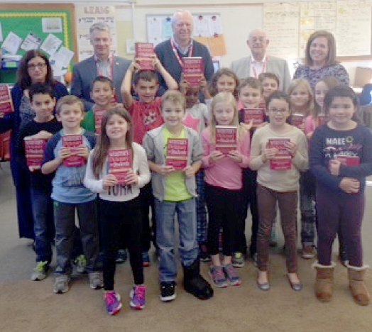 (above l-r), Rotary Officials Rose Marie Sinisi, Glenn Mortimer, John Schnakenberg, Bart Barre, and Deerfield Elementary Teacher, Mrs. Kathleen Goldbeck and the 3rd grade class.
