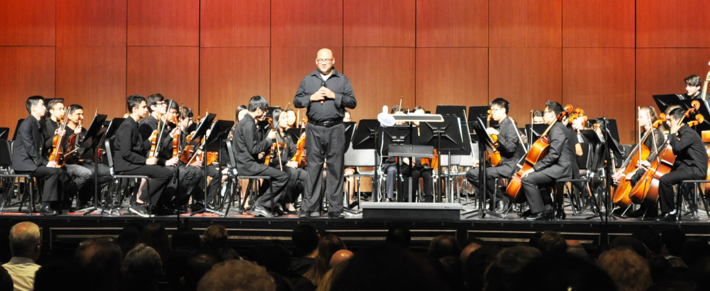 (above) Hundreds of instrumental music students at Watchung Hills Regional High School (WHRHS) filled the stage at the school’s Performing Arts Center (PAC), Wednesday, Dec. 16, for the annual Instrumental Winter Concert. Among the performances was by the String Orchestra, which opened the concert with three eclectic compositions which set the tone for the evening: The dramatic and haunting “Theme from House Of Cards,” by Jeff Beal; three excerpt from the classic seasonal favorite, “The Nutcracker,” by Peter Ilyich Tchaikovsky; and a contemporary piece with classic themes, “And The Mountains Echoed: Gloria!” by award-winning composer Robert Longfield, the band and orchestra director at Miami Palmetto Senior High School, Miami.