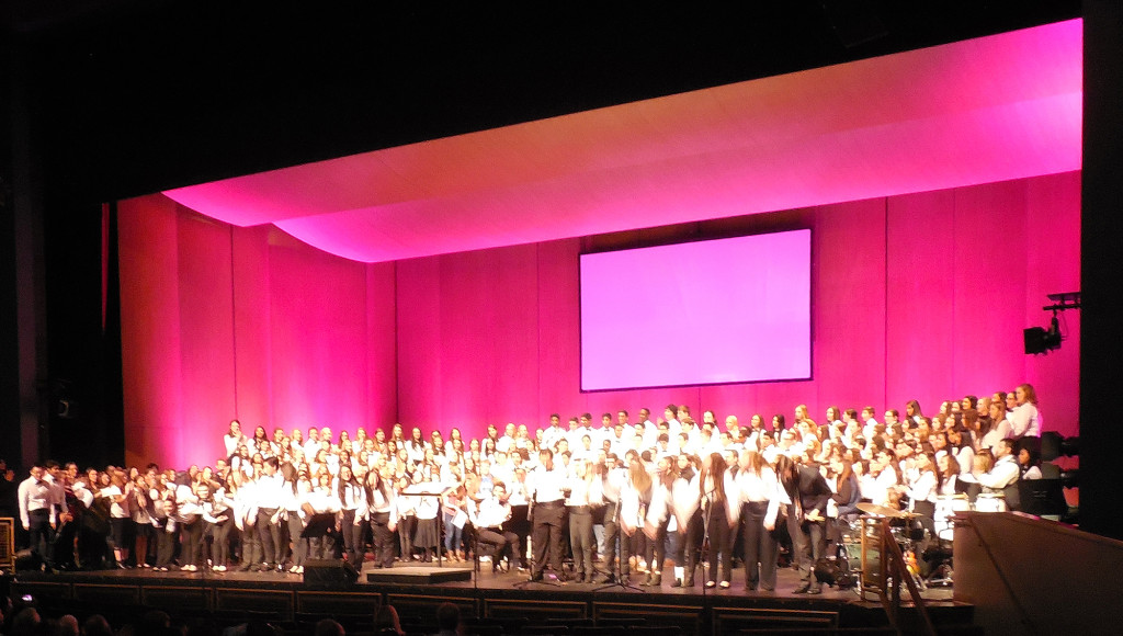(above) Hundreds of choral music students filled the stage of an equally filled Performing Arts Center (PAC) two nights later, on Friday, Dec. 18, for the annual Winter Vocal Concert. This Combined Chorus included members of the Chorus and Advanced Chorus. They performed the final three songs of the concert, ending with “We Are The World for Haiti,” by Michael Jackson and Lionel Ritchie.