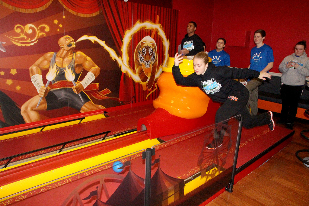 (above, l-r) Alexis Dulko of Linden tries his hand at the mini bowling at Jersey Lanes.