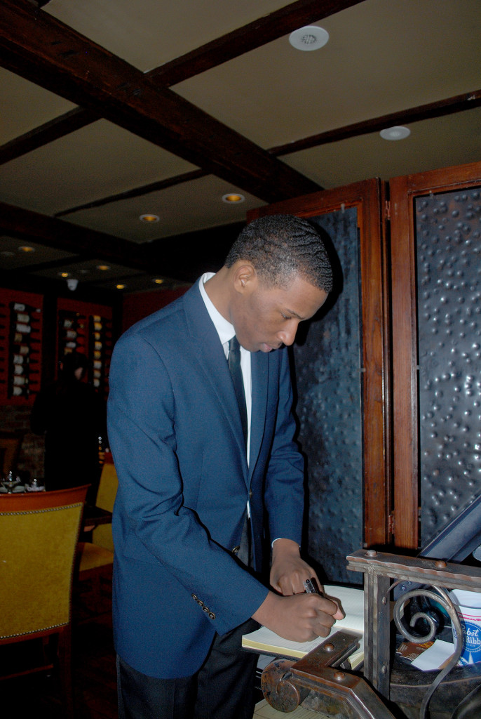 (above) Xavier Lighten reviews the evening's reservations.
