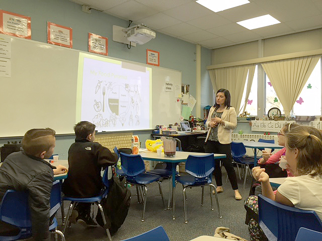 (above) Mrs. Laura Holcomb speaking with students during Hehnly School’s Breakfast Bunch Club meeting.