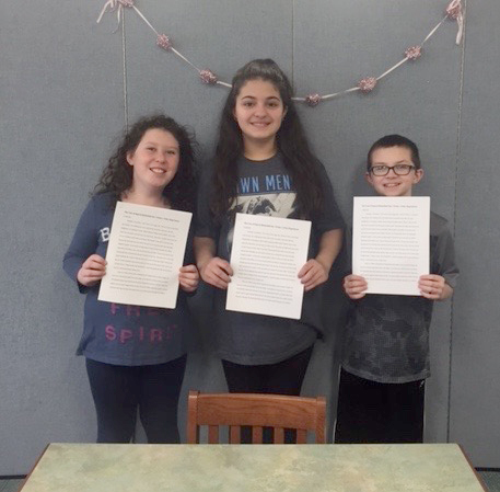 (above, l-r) Mackenzie Nielson, Gina Galiszewski, Timothy Ford holding their winning case.