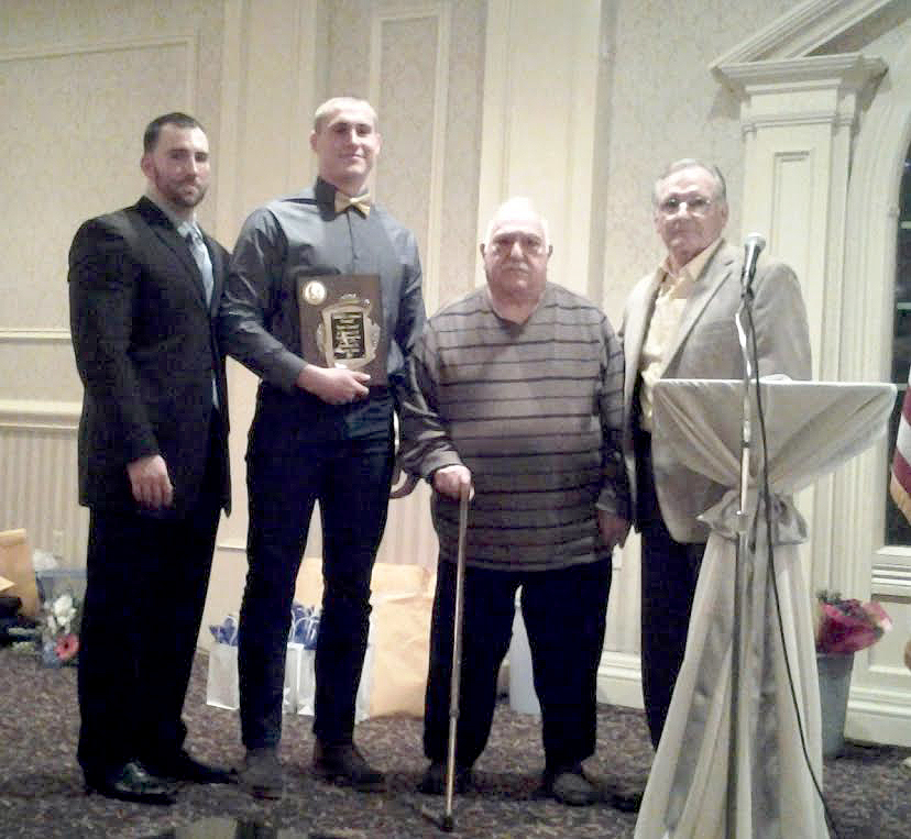 (above) The Thomas Santaguida “Saint of the Year” Award being presented to 2015 recipient Justin Falke. Pictured are Anthony DelConte, Justin Falke, Vin Albano, and Bob Taylor.