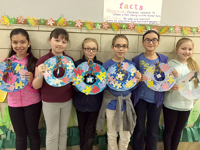 (above) Mrs. Kim Picciano's first grade class worked with Miss Sophia Halkias' fifth graders on a puzzle project which celebrated student differences. Photos by Linden School No. 8