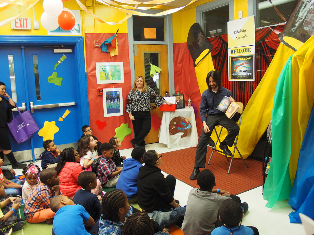 (above) Linden Public Schools art teacher and author, Mark Kohut discusses his inspiration in writing his children’s book, “Red, Yellow, Blue, Black, Gray & White” during their tour of “Books Come Alive at School #5”.