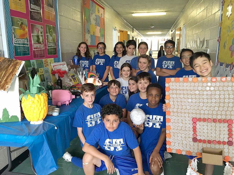 (above) Mrs.Aronowitz and her 6th grade class at St. Theresa School in Kenilworth did a project called " Garbage Art" with recycled materials. Sixth grade is currently studying Earth's Resources and were asked to create a piece of "Garbage Art" with materials from the home. They used their resources and imagination and were very creative from a basketball board to a pineapple light.