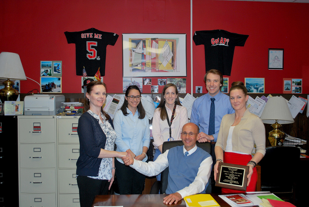 (above) Rahway High Principal Farinella, seated, was recently honored by Kean University.