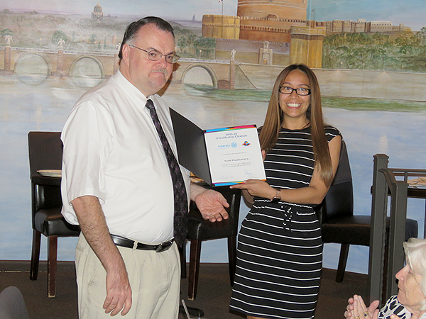 (above) Rotary President-Elect Michael Castoral presents a Rotary International Presidential Citation to Alexandra Pereira, North Plainfield High School Interact Club adviser, in recognition of the club’s accomplishments in 2015-2016.