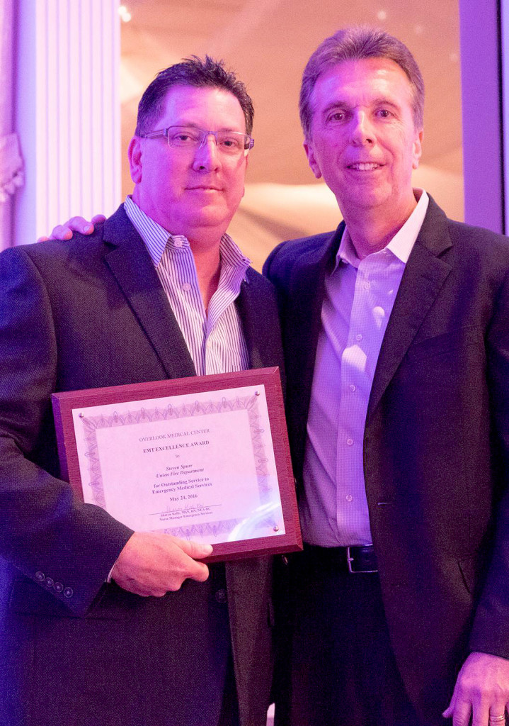 (above) Captain Steven Spurr of the Union Fire Department has been honored with a 2016 EMT Excellence Award from Overlook Medical in Summit. He received a plaque presented to him by the department’s chief, Thomas Byrne.