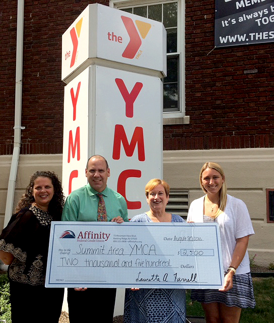 (above) Erin Witherspoon; foundation development administrator Dr Lauretta A Farrell; AVP External Affairs Executive Director presenting check with Paul Kieltyka, CEO & President of the Summit Area YMCA and Terri Clinton, Executive Branch Director of the Summit YMCA.