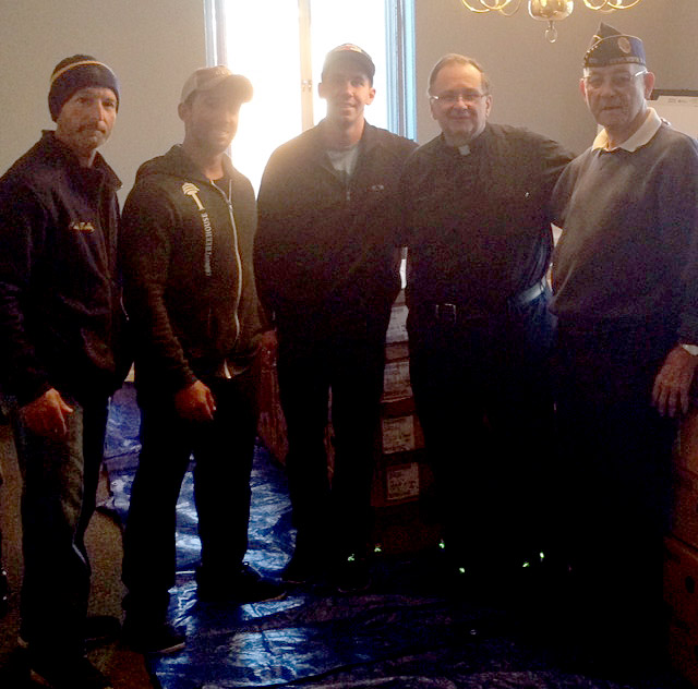 (above) Kenilworth PBA #135 State Delegate Bob Cox, Crossfit Treehouse trainers Elian Velazquez and Corey Chandler, Father Joe Bejgrowicz from St Theresa’s Church and Ed Miller from the Kenilworth Veterans Center posing in front of the turkeys after they were delivered.